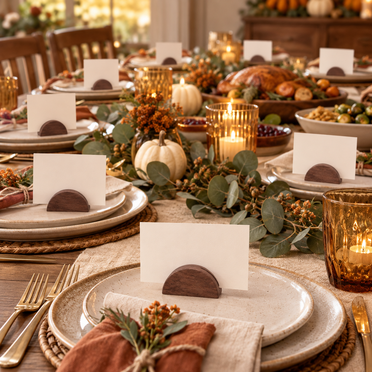 Brown wooden semicircular place card holders styled on a Friendsgiving table