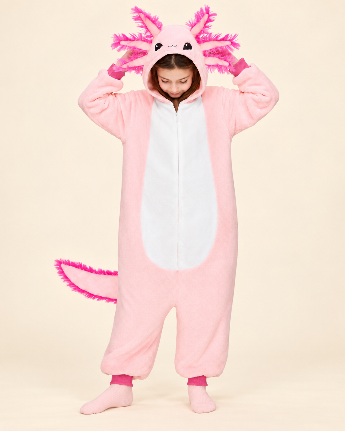 Child wearing a pink axolotl costume onesie