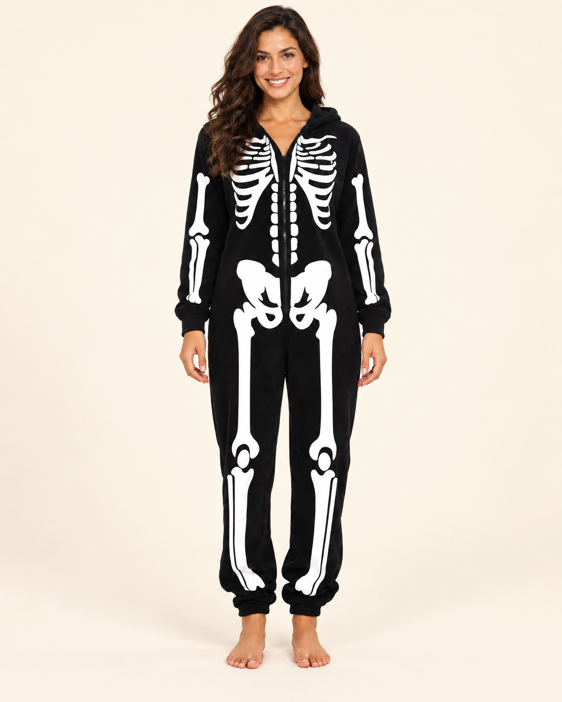 Adult wearing a black skeleton hooded onesie