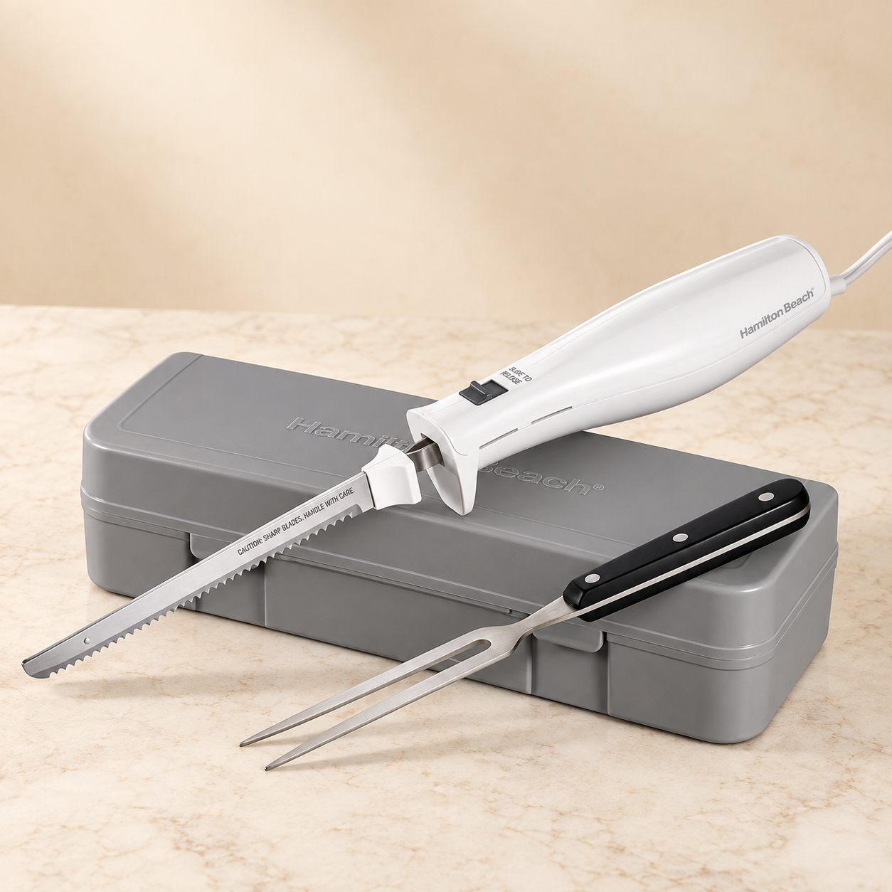 Hamilton Beach electric carving knife with gray storage case and carving fork
