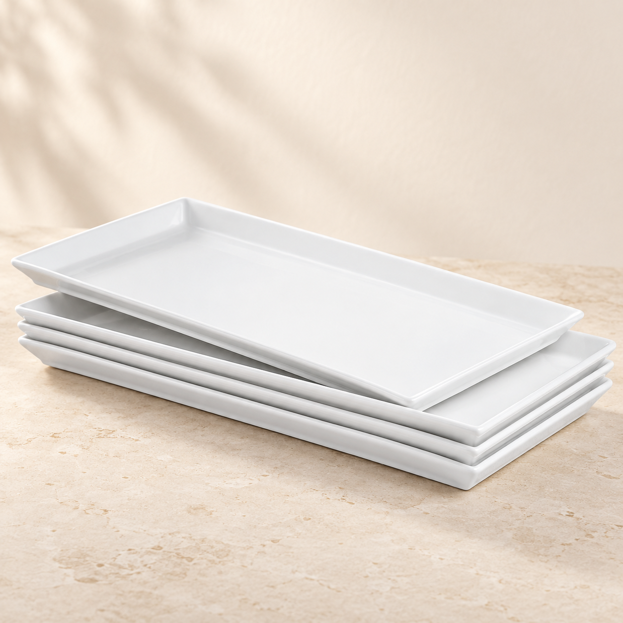 Four Sweese 15.5-inch white rectangular porcelain serving platters